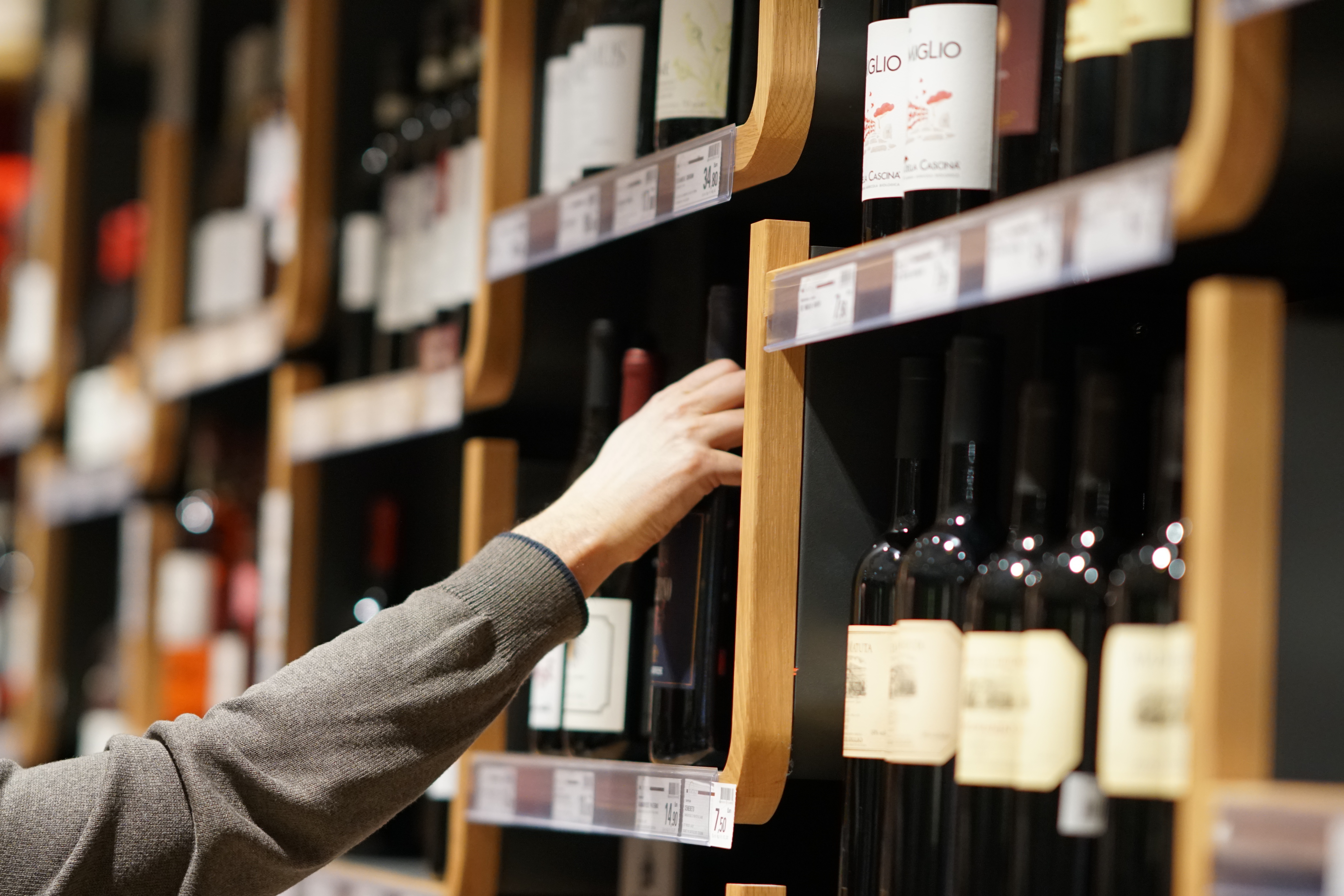 Wine shop choosing. Wine Shopper.